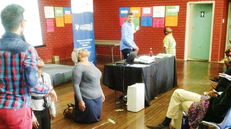 Participants in Project Management workshop taking on a challenge by facilitators